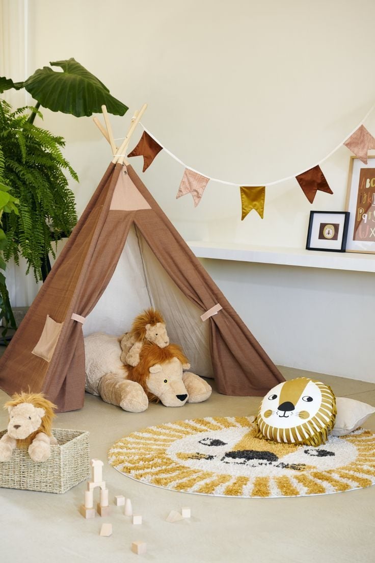 Photo of a kiddie tent with plush toys around