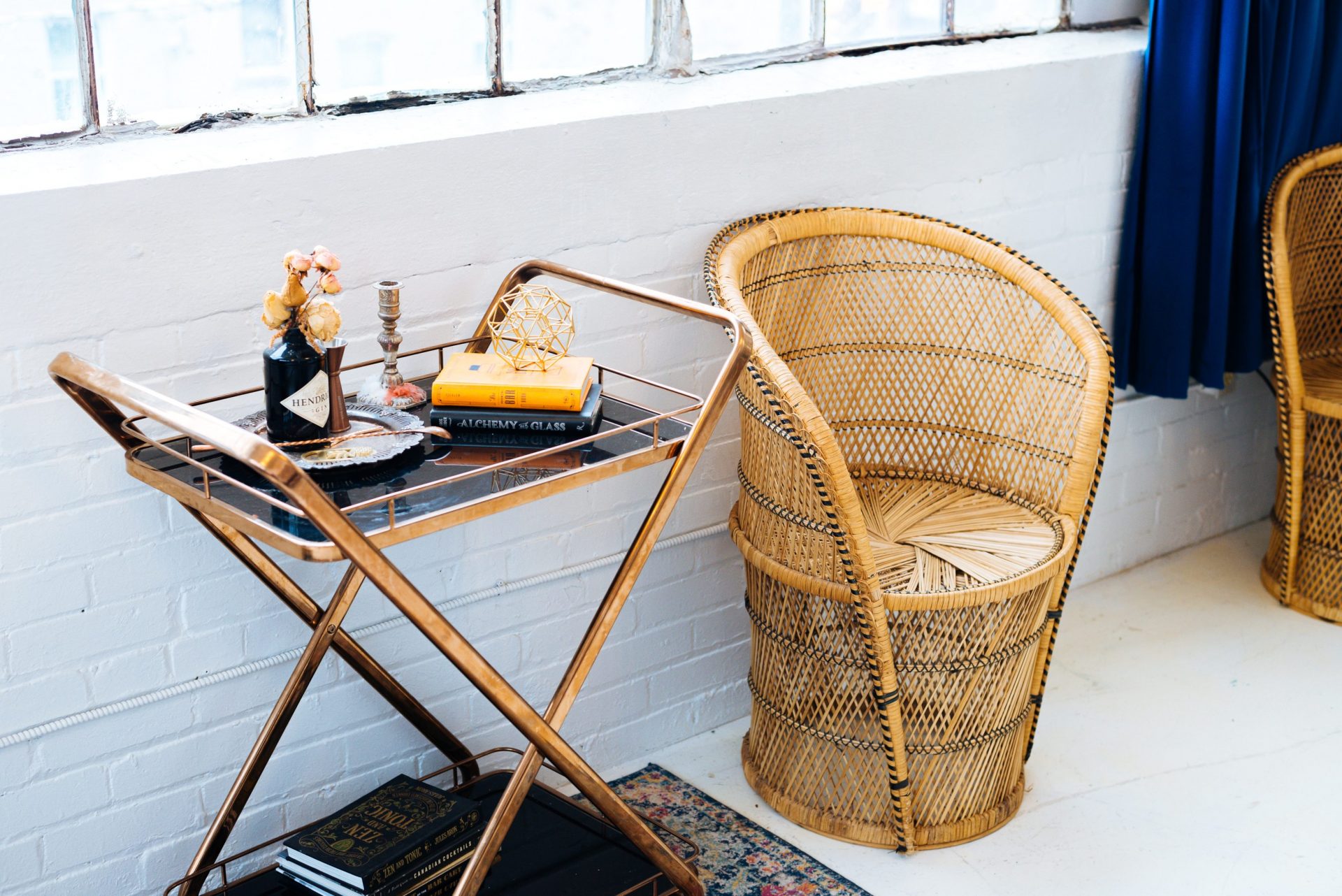 Mid-century table top beside rattan chair