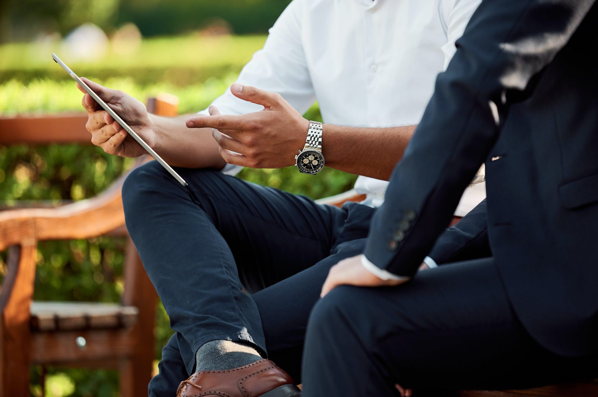 photo of 2 people having a discussion outside