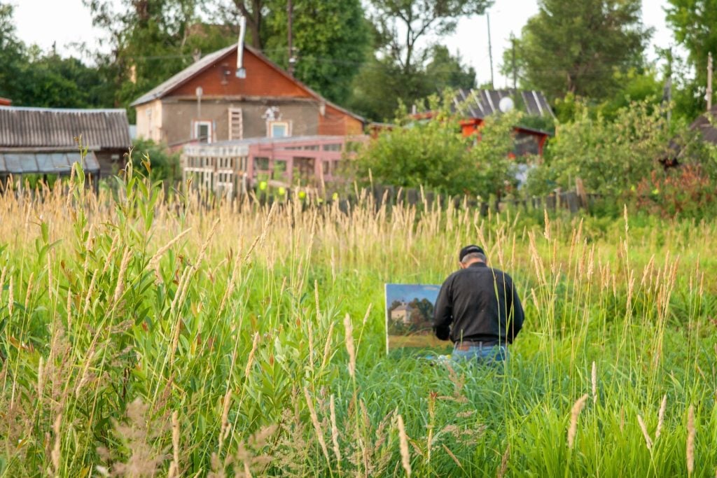 Man Painting Amidst Relaxing Nature