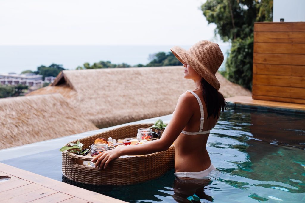 Woman Enjoying a Floating Breakfast