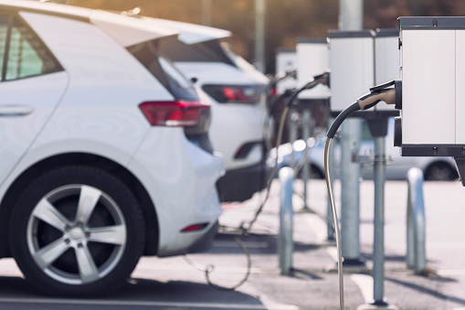 A parking lot with charging stations for electric cars.